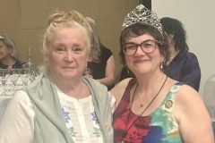 Carell Wingrave, Governor of the WCR 2000 - 2002, proudly accepted her owl pin from Governor Chari Grant